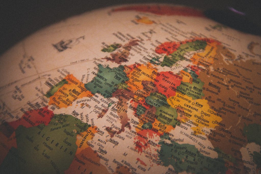 christian lue 7dEyTJ7 8os unsplash europe on globe