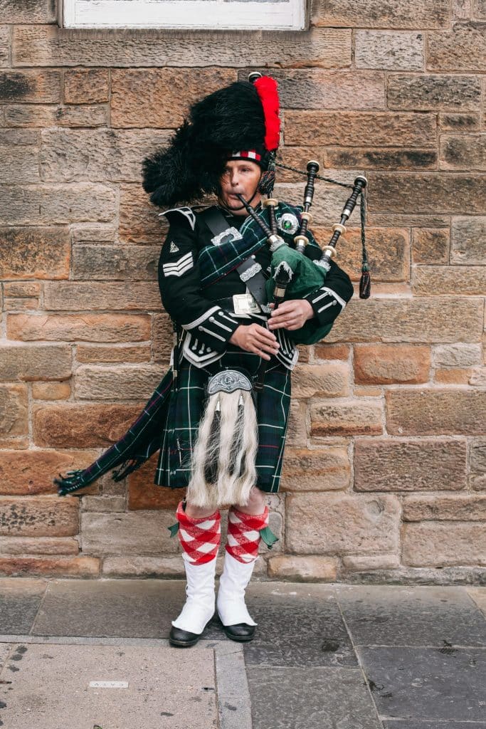A Man Playing Bagpipes in Edinburgh, Scotland, United Kingdom