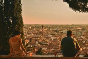 Back View of People Sitting on a Wall with a Panoramic View Verona, Veneto, İtaly