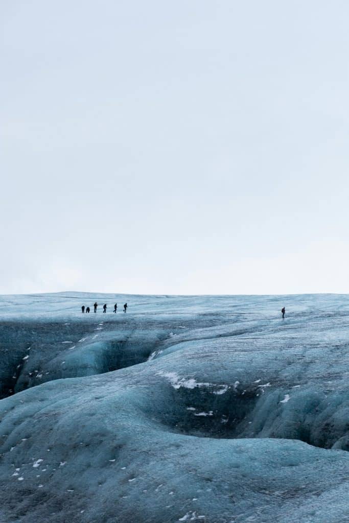 People Walking on Snow Covered Field in Iceland