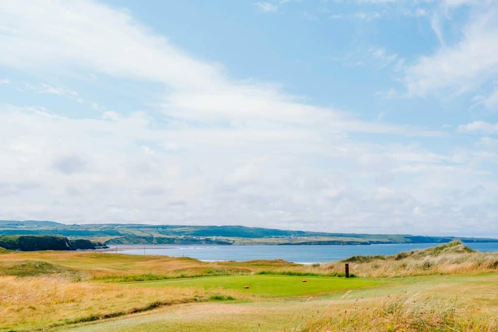Beautiful landscape with houses and clouds in Lahinch Golf Club, Dough, Lahinch, County Clare, Ireland